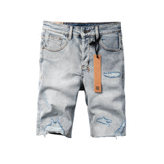 Men's Vintage Light Wash Ripped Denim Shorts with Raw Cut Hem and Distressed Details 2003